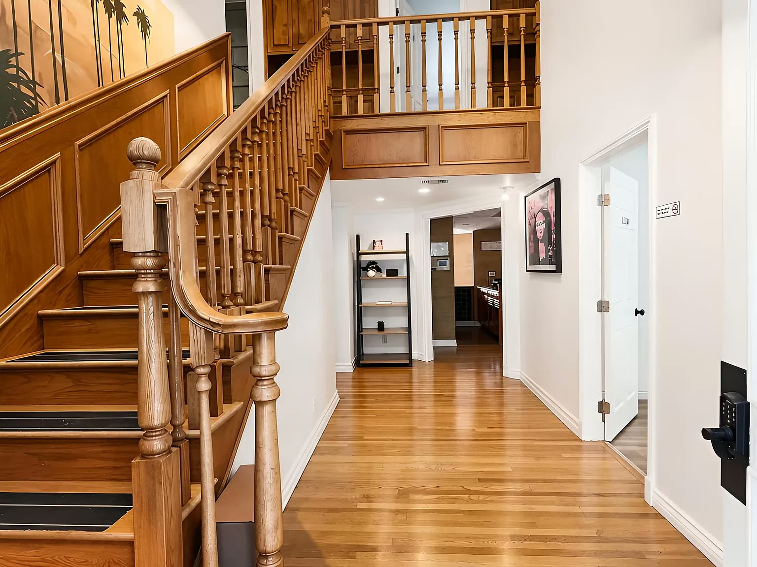 The wood staircase inside the Next Phase residence