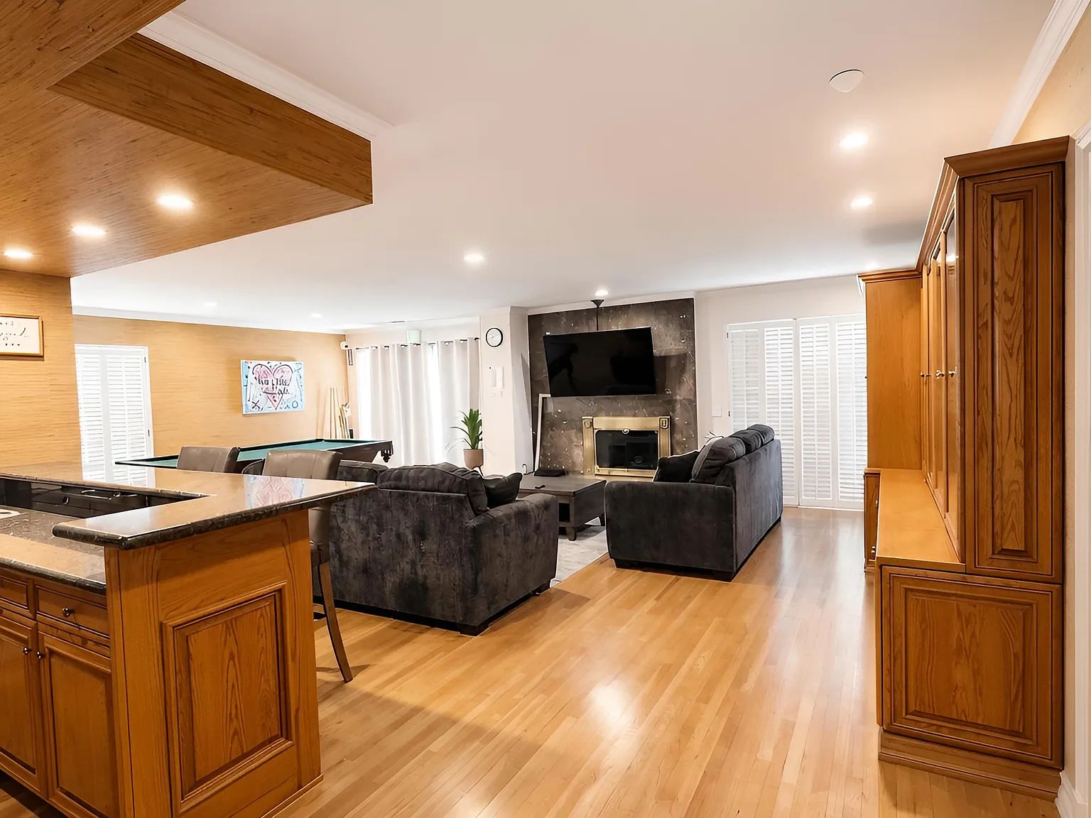 The shared living room with kitchen bar seating